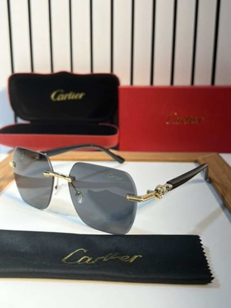 Rimless gold panther black sunglasses - flat lay with Cartier red case, box and cleaning cloth