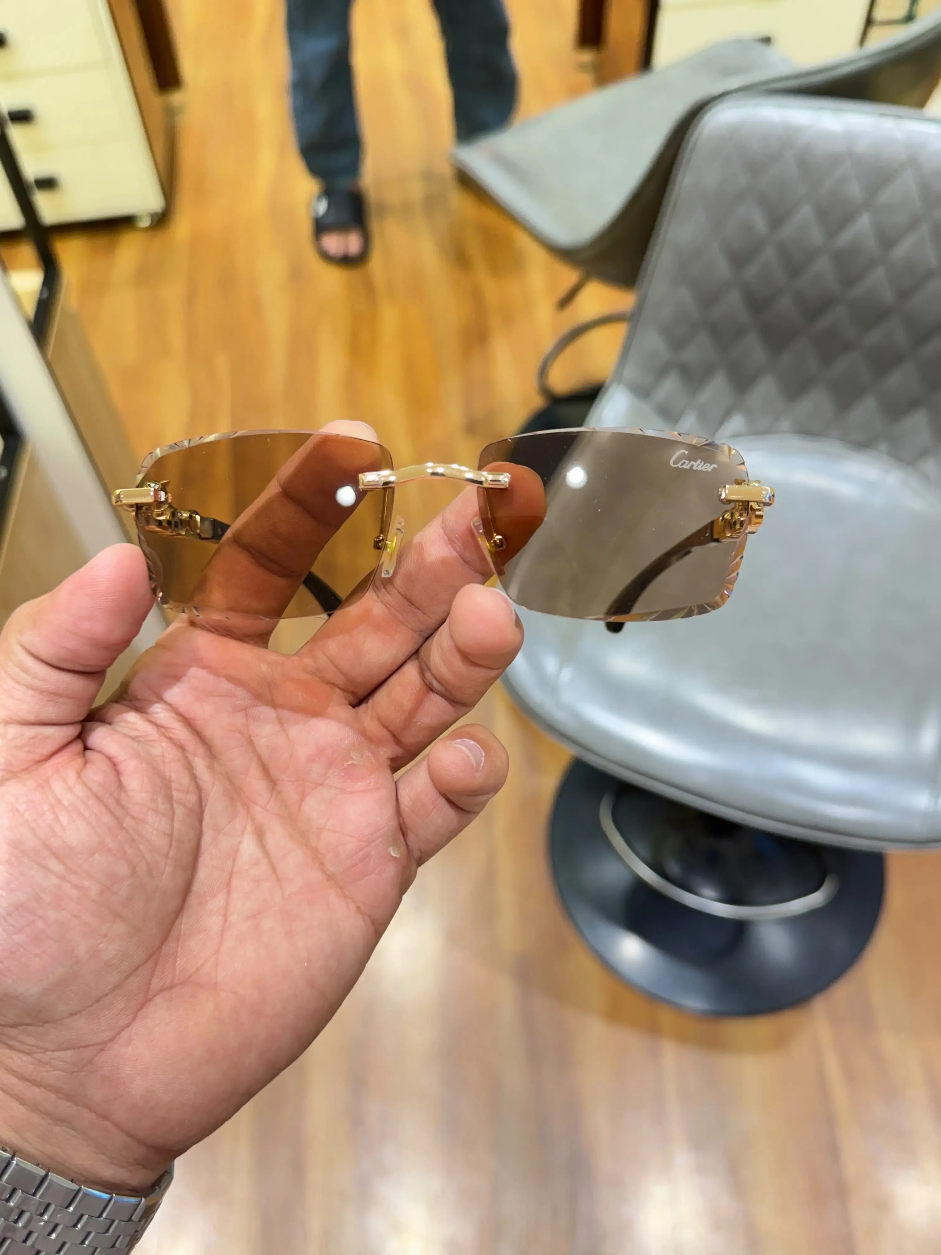 Amber rimless sunglasses - front view with gold chain-link bridge