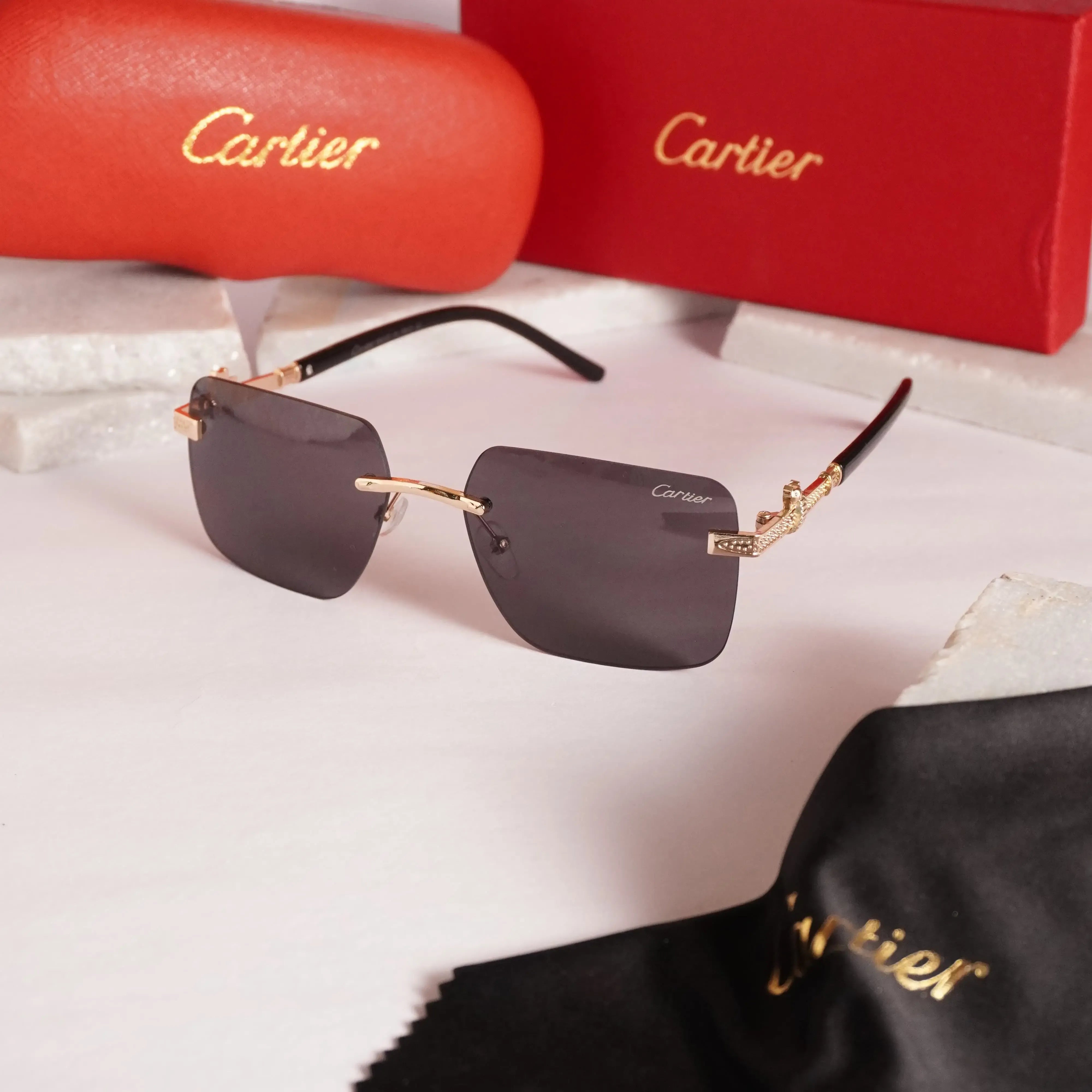 Rimless square gold black sunglasses - front view with Cartier red case and cleaning cloth