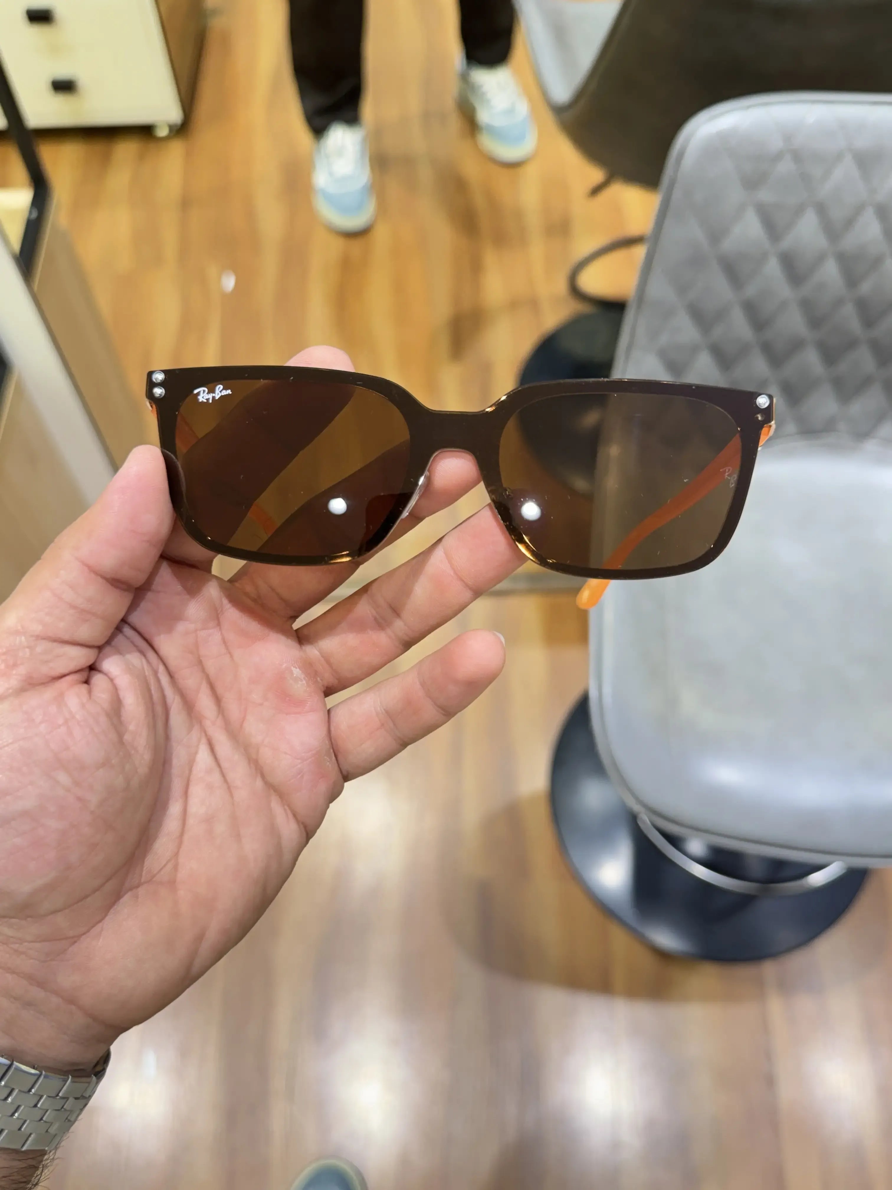 Ray-Ban RB2507S Orange Brown - Front face-on view showing dark navy frame with warm brown lenses and Ray-Ban logo