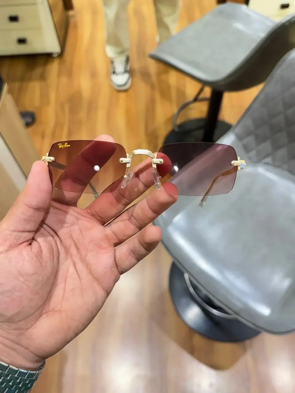 Ray-Ban Rocky Gold Brown - Front view showing rimless square lenses with Ray-Ban logo