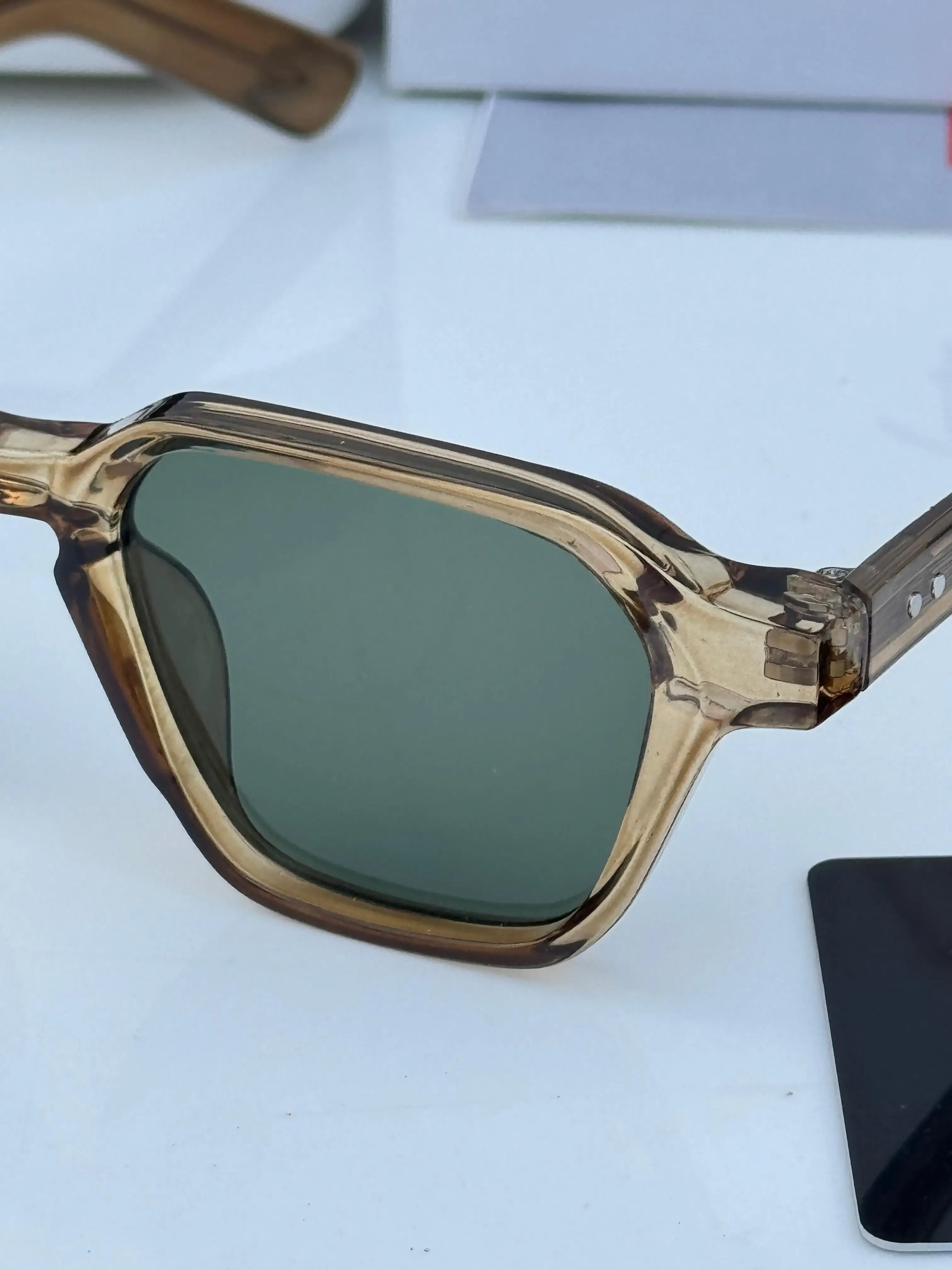 Ray-Ban RB1115 Brown Green - Front face-on view showing transparent brown frame and green lenses
