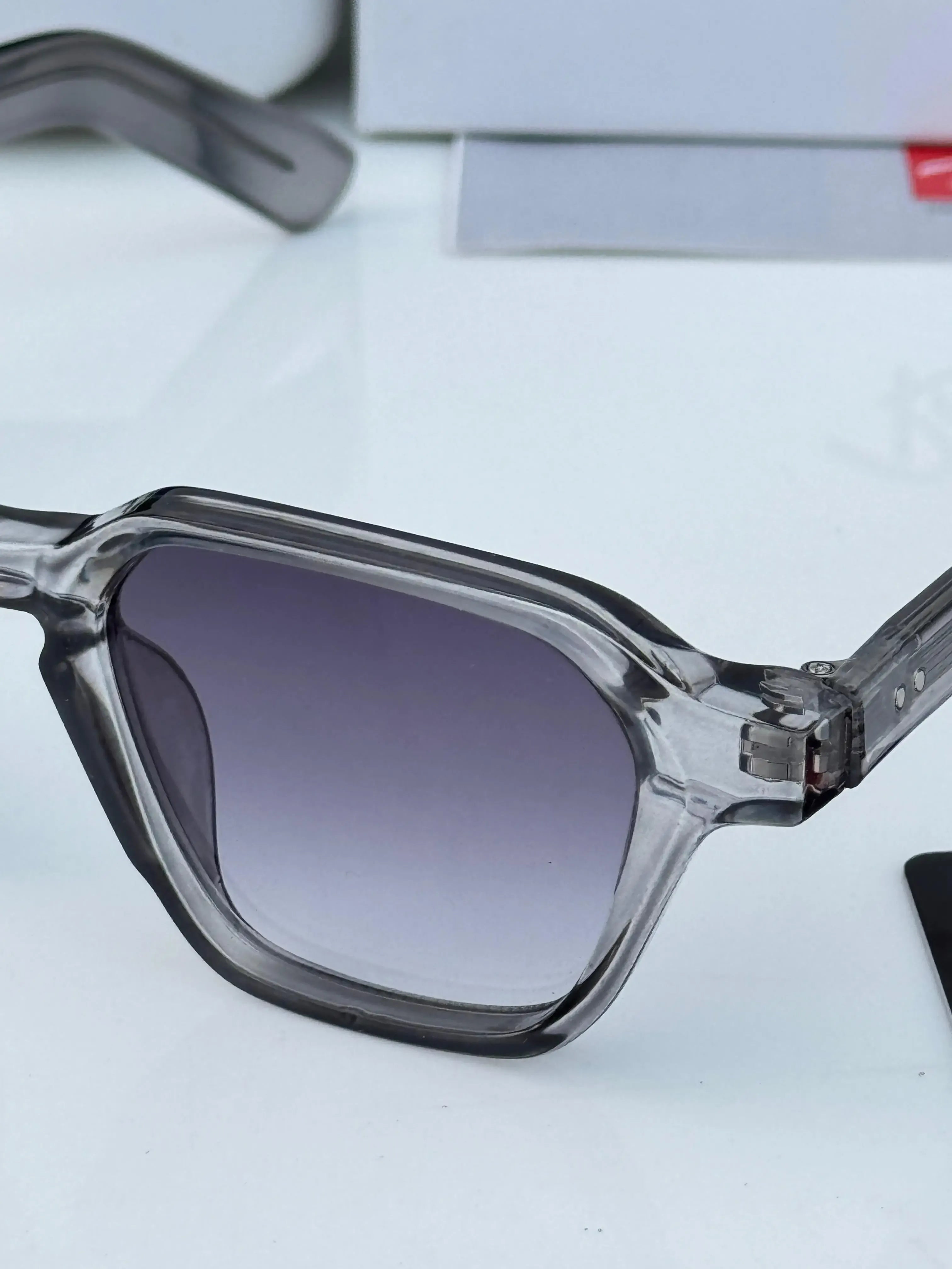 Ray-Ban RB1115 Grey Shaded - Front face-on view showing transparent grey frame and purple gradient lenses