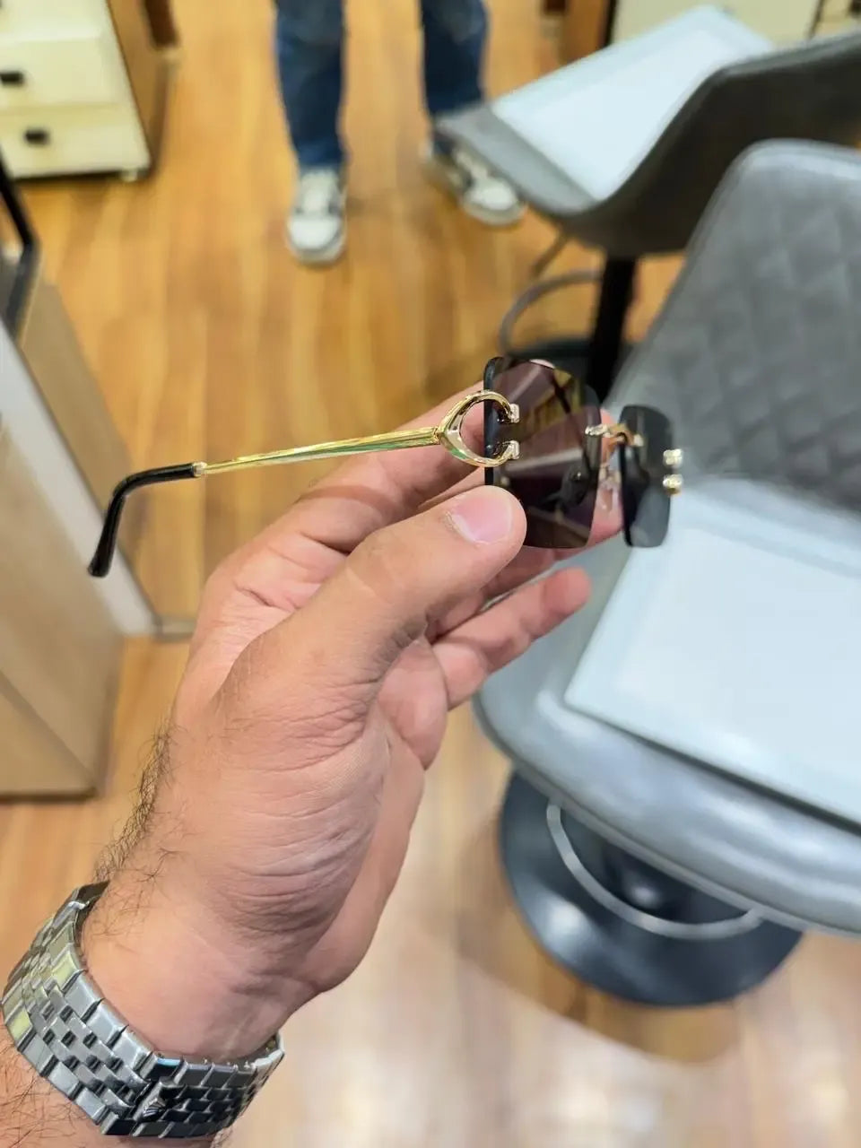 Rimless gold C-frame dual tone sunglasses - front view showing dual tone gradient lenses and Cartier branding