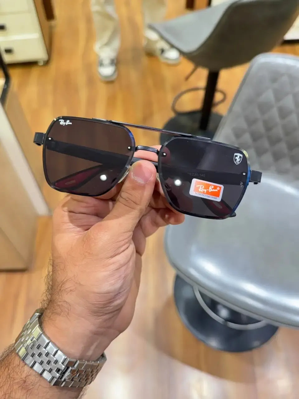 Ray-Ban x Ferrari RB3900 Black - Angled front view with Ferrari shield logo