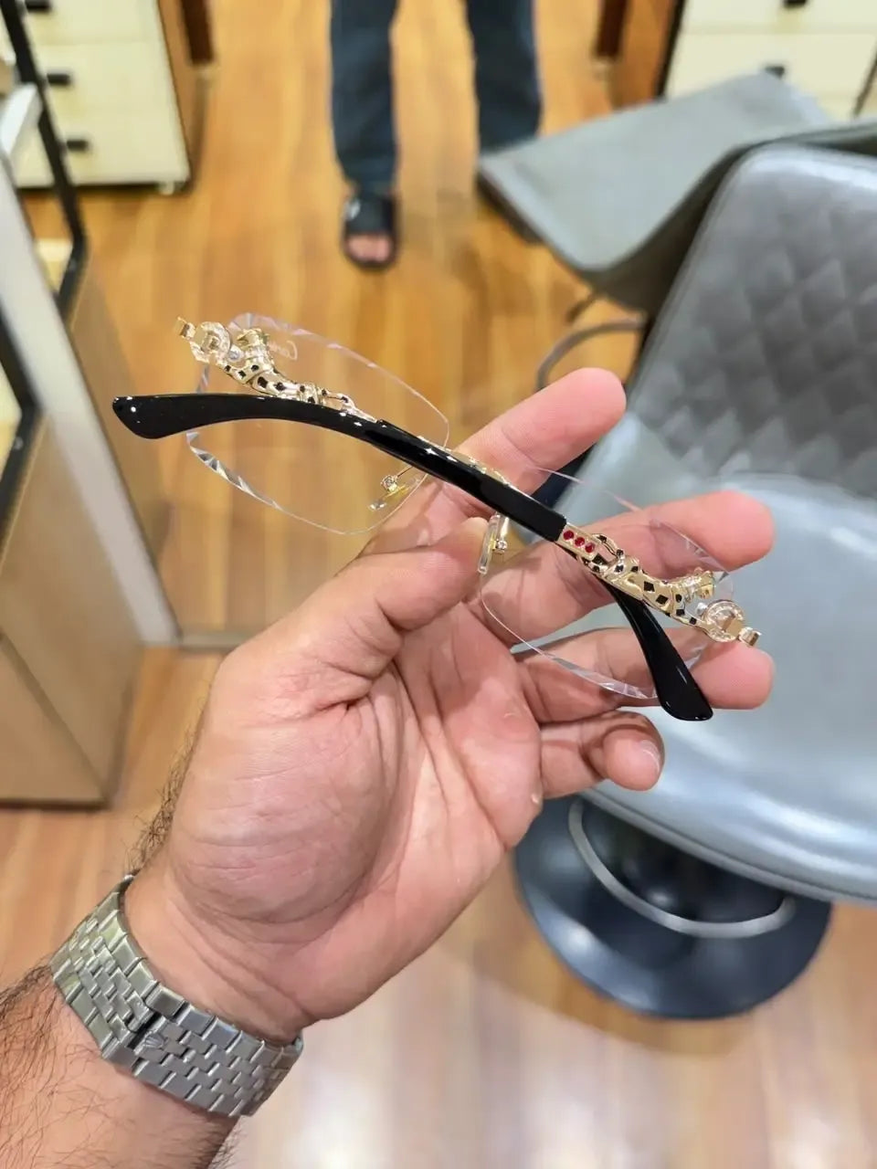 Rimless gold panther body bridge eyeglasses - front view showing clear plano lenses and full gold panther bridge