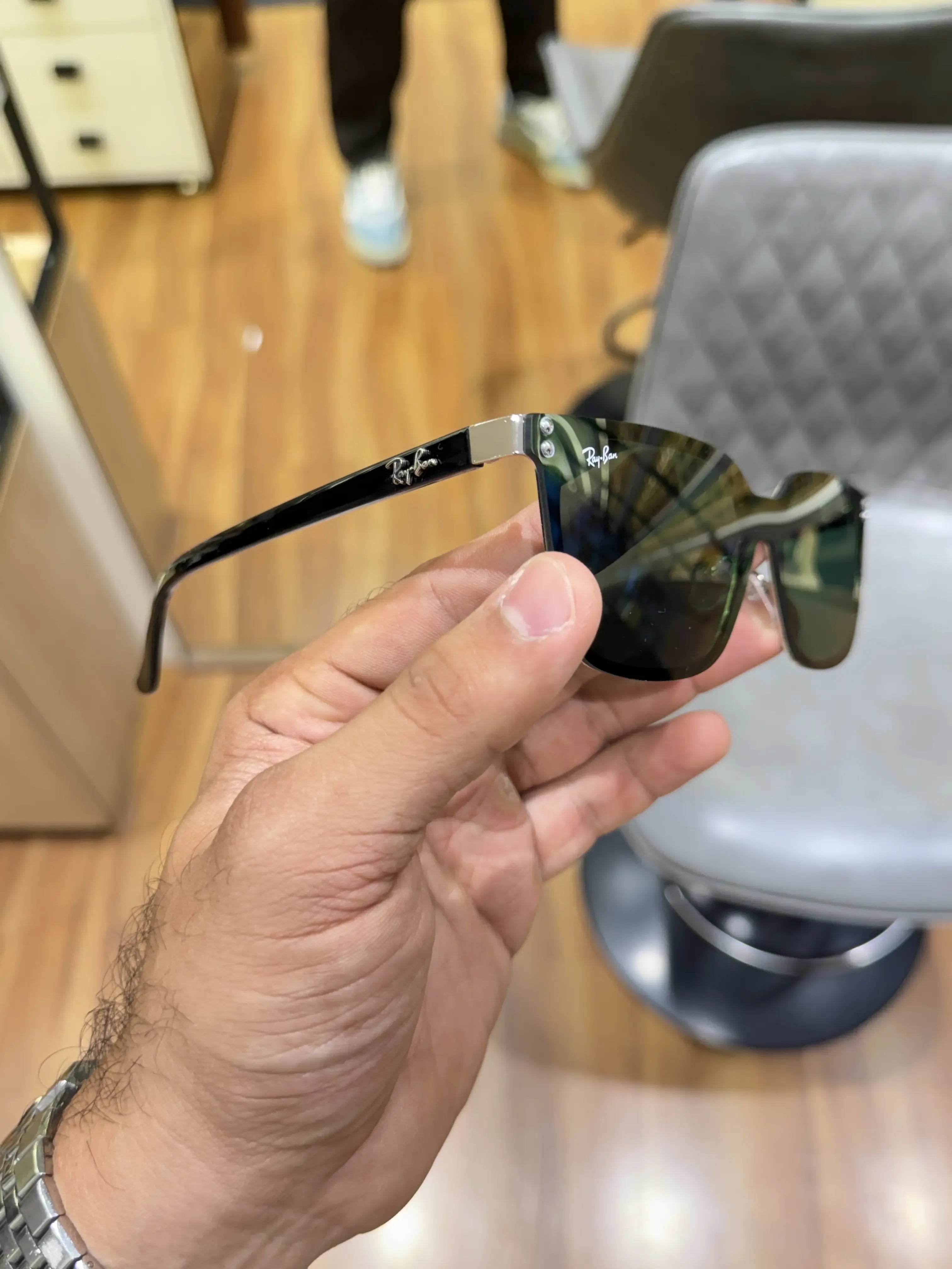 Ray-Ban RB2507S Black Green - Palm view showing oversized rectangular black frame and deep green lenses