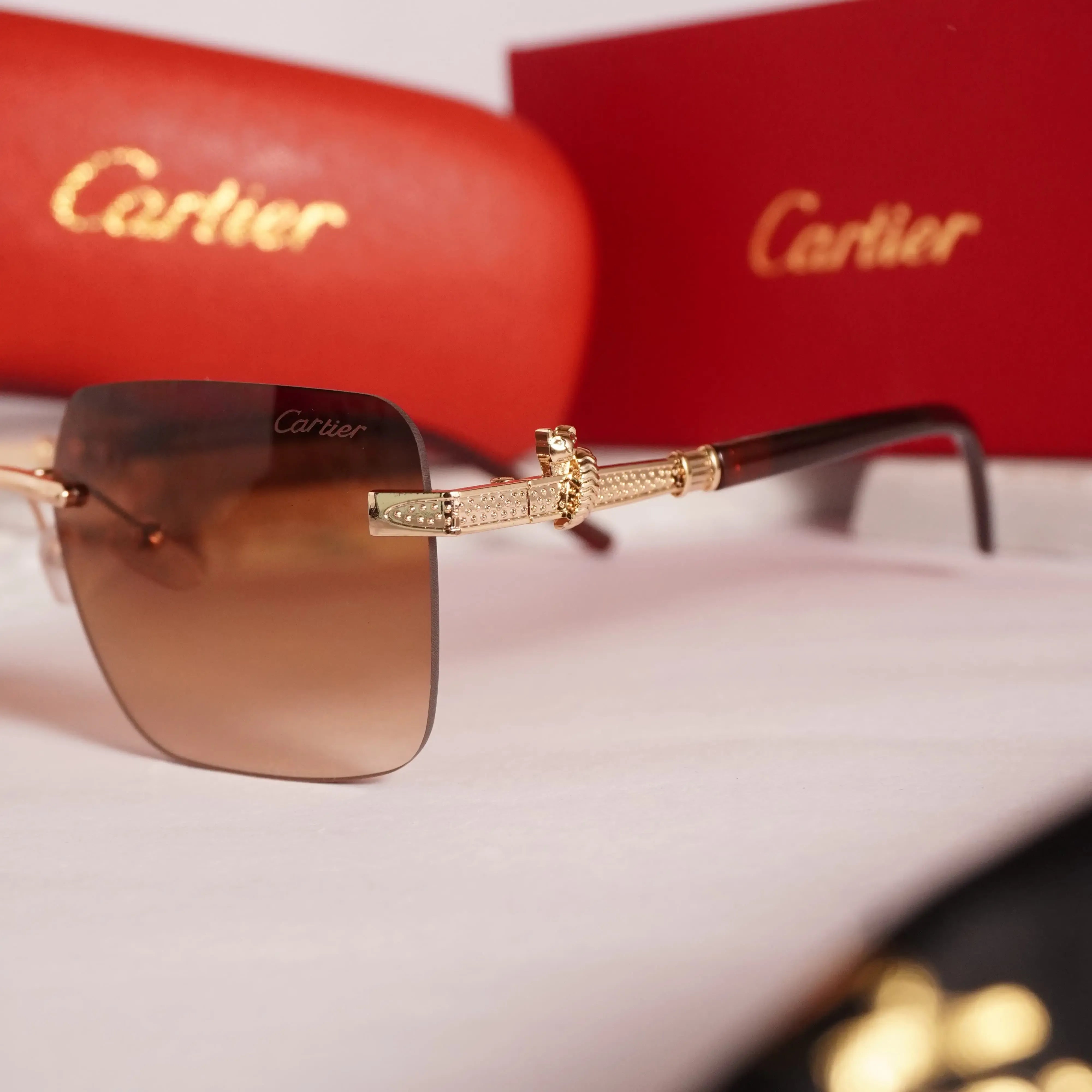 Rimless square gold brown gradient sunglasses - front flat lay showing full frame and gradient lenses