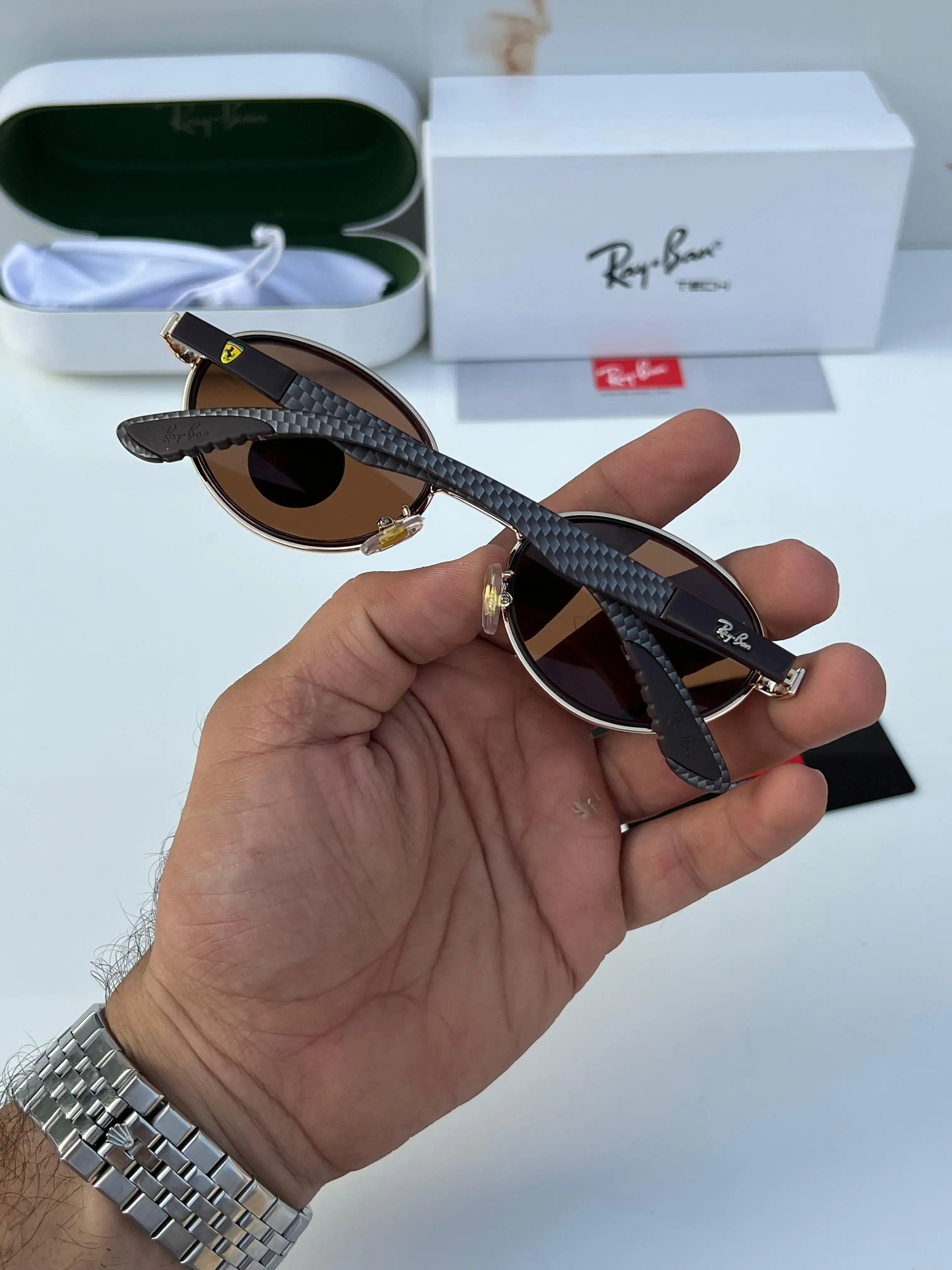 Ray-Ban x Ferrari RB8206 Gold Brown - Close-up of lens showing polarized brown lens and gold metal rim detail