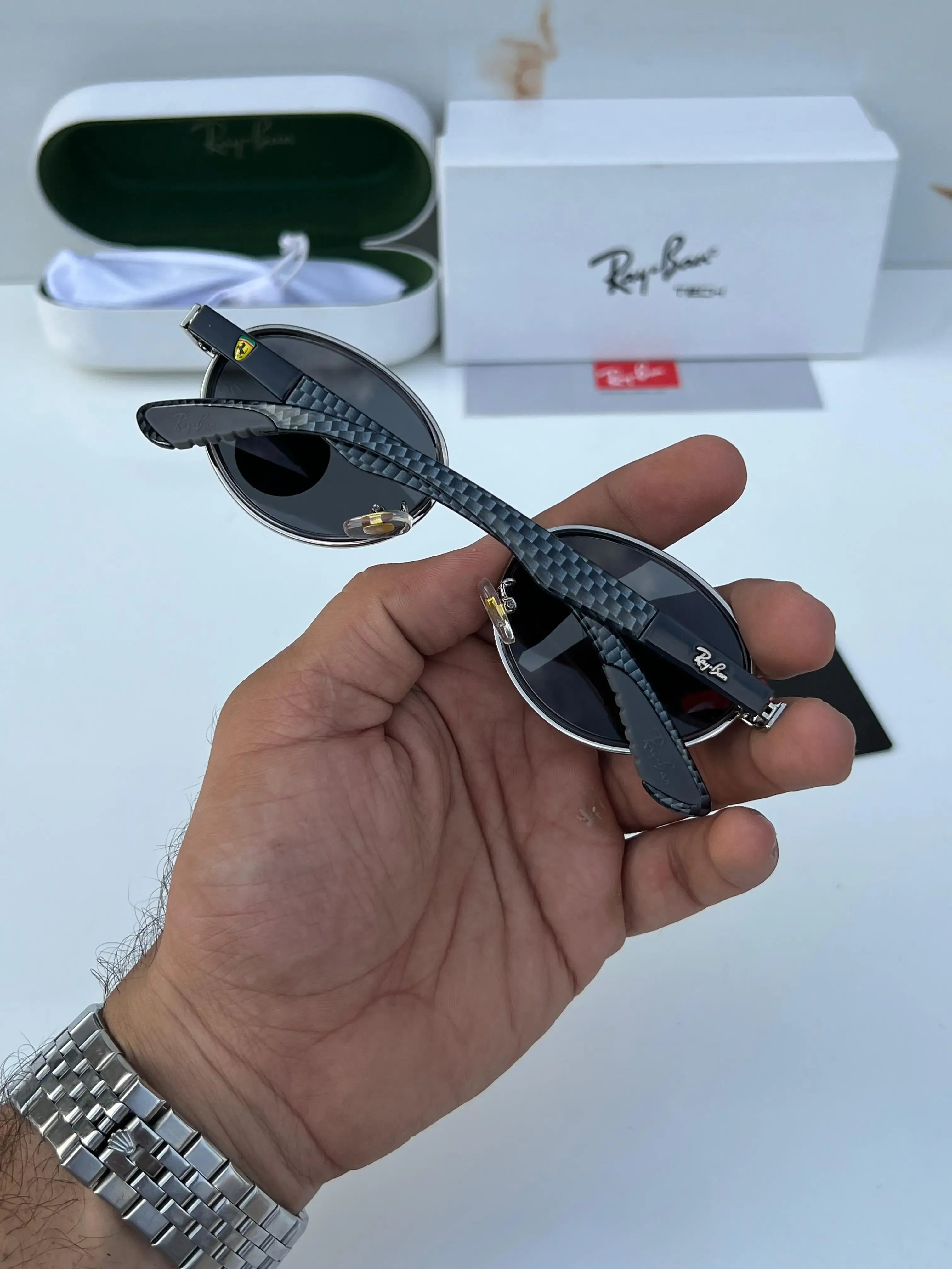 Ray-Ban x Ferrari RB8206 Silver Black - Flat lay showing frame with Ray-Ban Tech white box, green hard case and Ray-Ban card