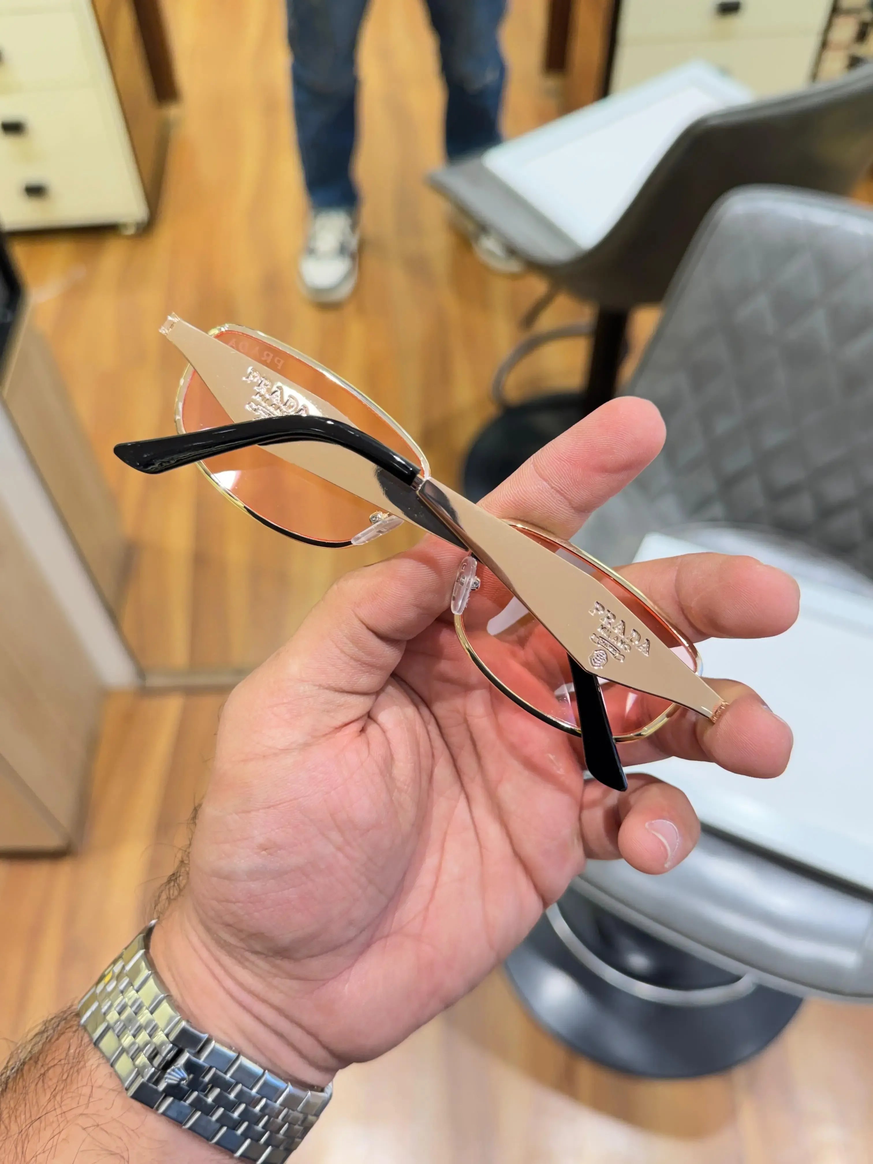 Prada Rose Gold Aviator Sunglasses - Folded Side View with Blade Temples