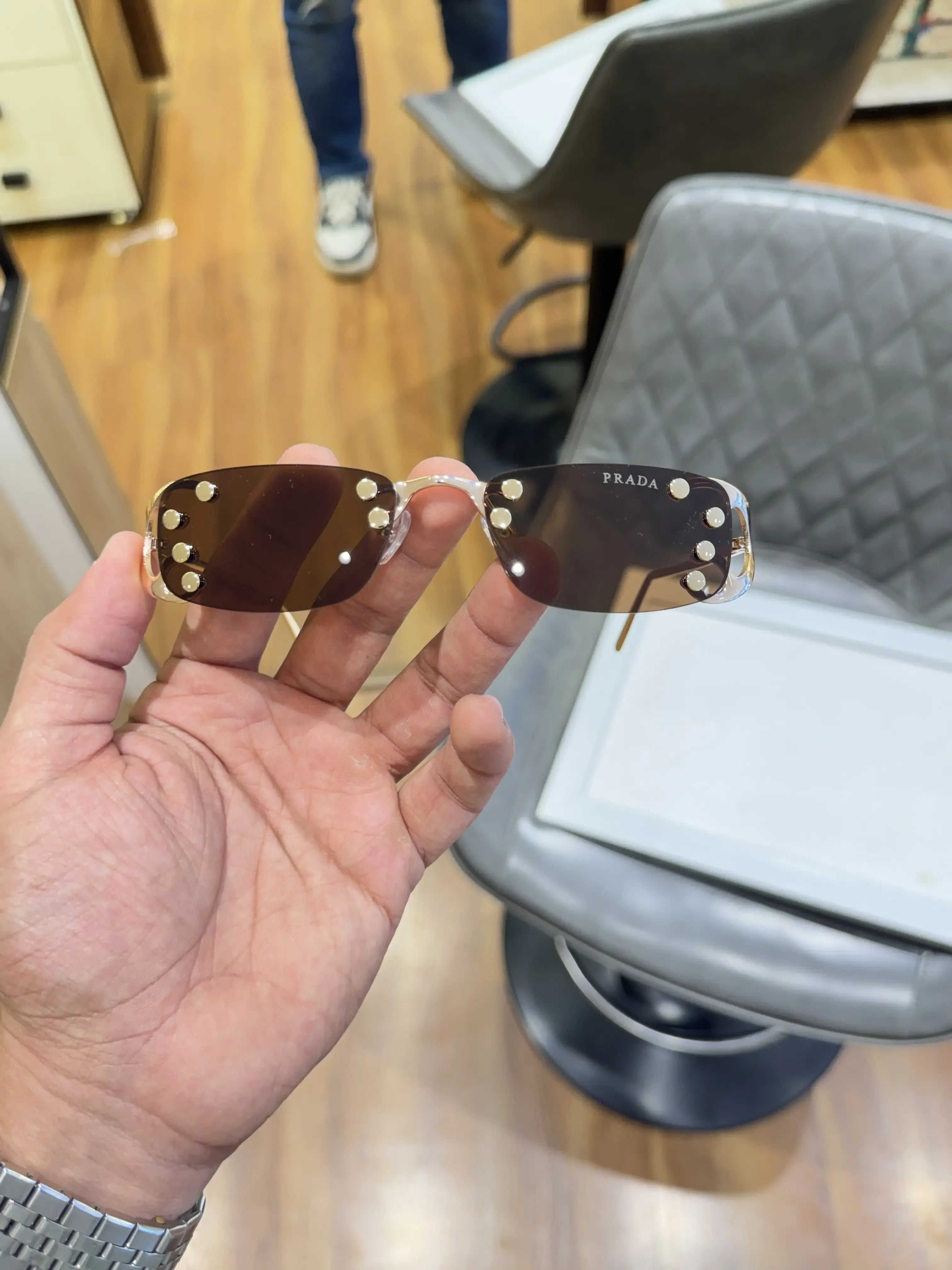 Prada Luxe Rimless Sunglasses Gold Brown - Front View with Studs