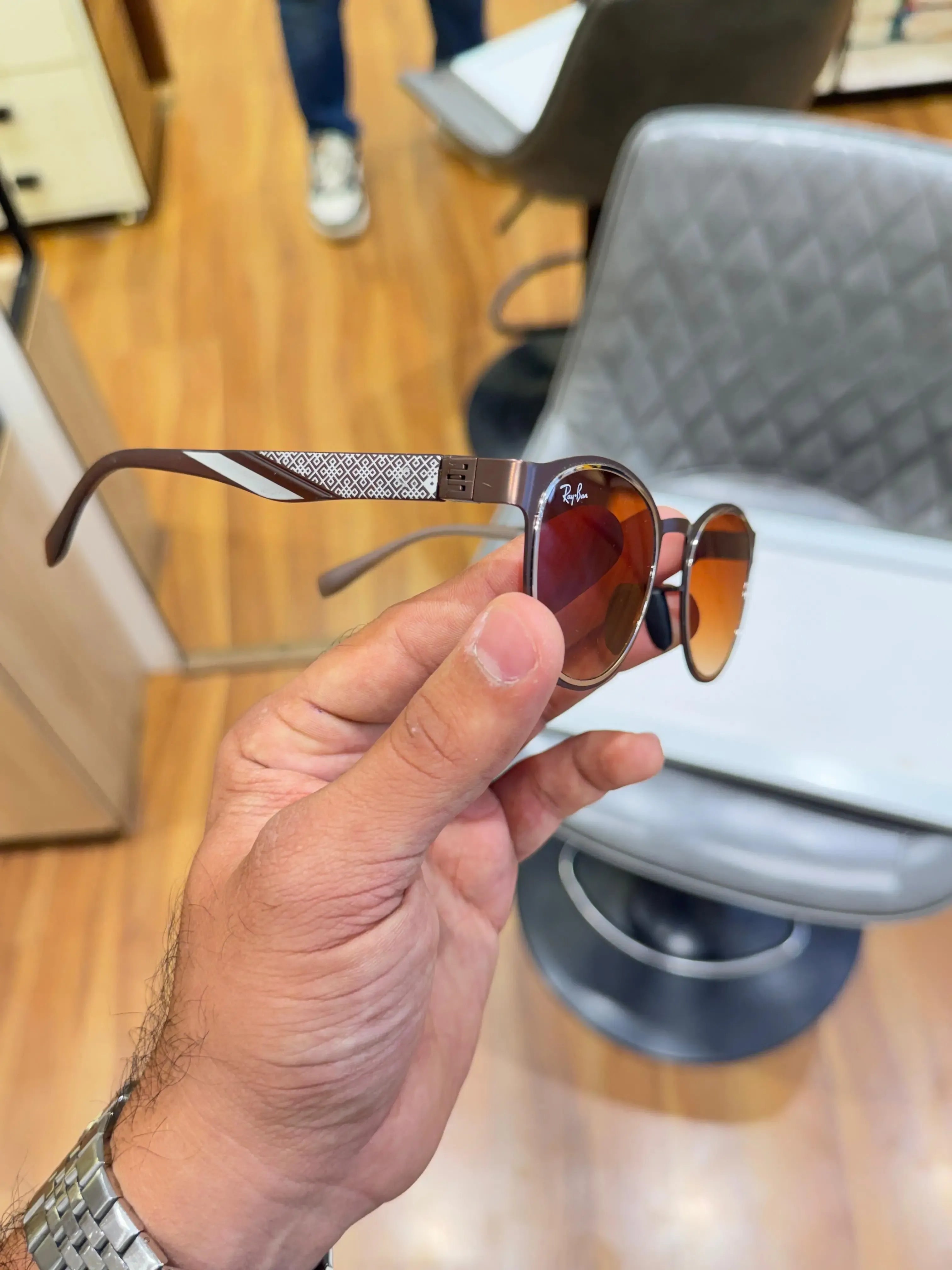 Ray-Ban RB2604 Brown Shaded - Folded display showing white geometric diamond-pattern temple arms with yellow Ray-Ban branding