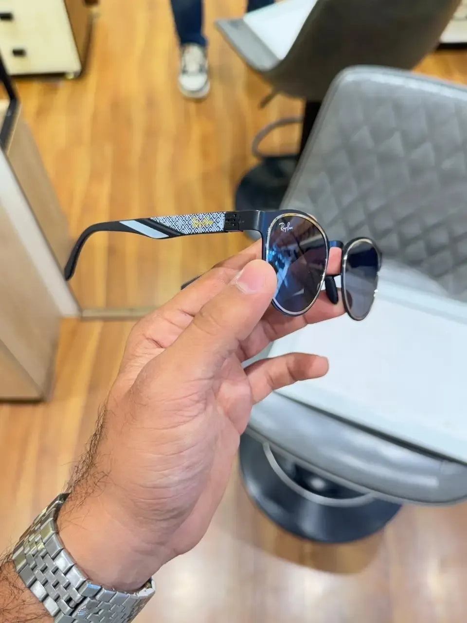 Ray-Ban RB2604 Black Silver - Side temple view showing geometric diamond-pattern arms with black stripe and yellow Ray-Ban branding