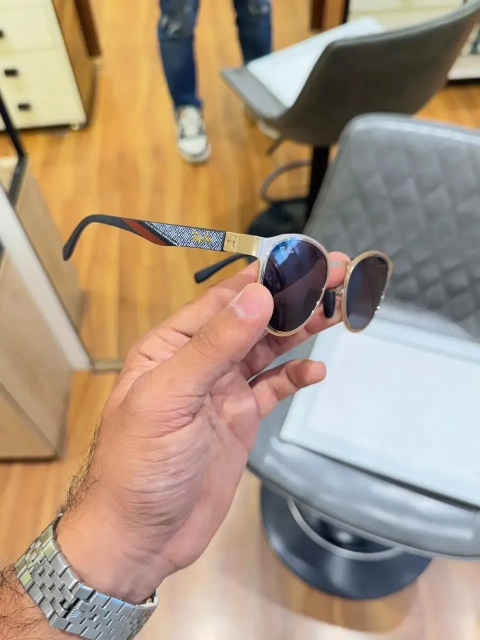 Ray-Ban RB2604 Gold Black - Side temple view showing blue white geometric diamond-pattern arms with yellow Ray-Ban branding