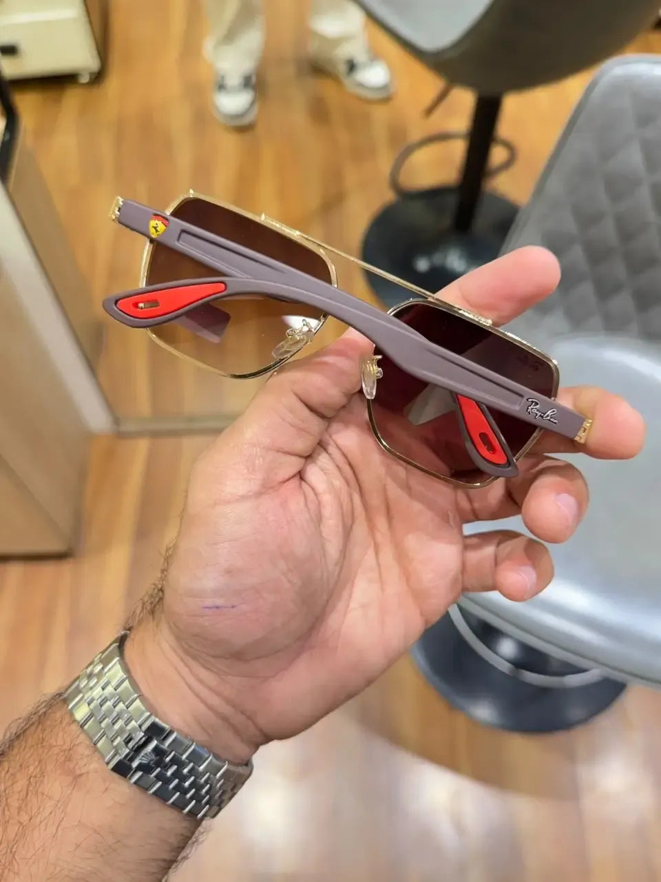 Ray-Ban x Ferrari RB4406M Gold Brown - Folded display showing mauve grey temples and red Ferrari tips