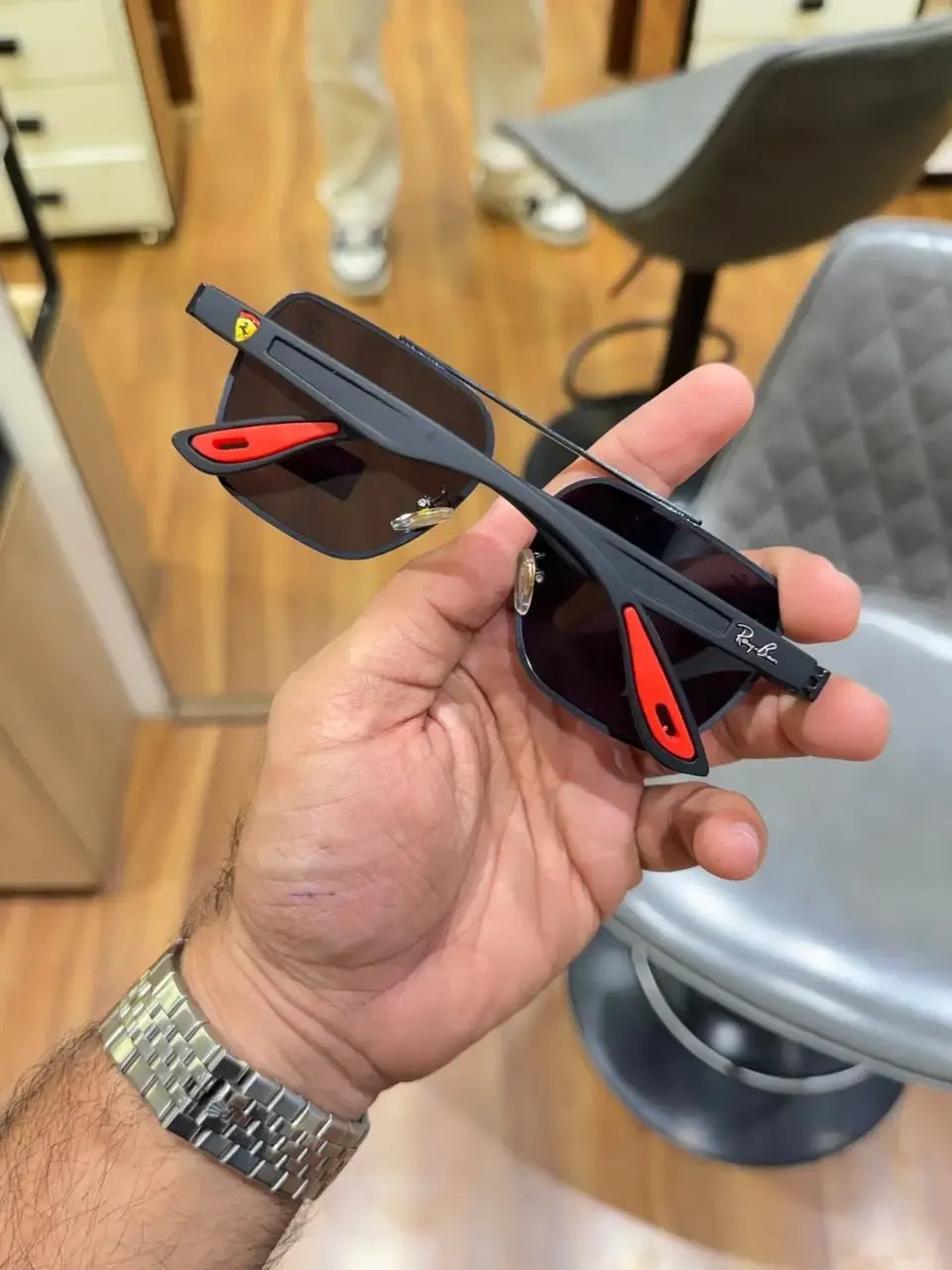 Ray-Ban x Ferrari RB3900 Black - Folded display showing red temple tips and Ferrari logo