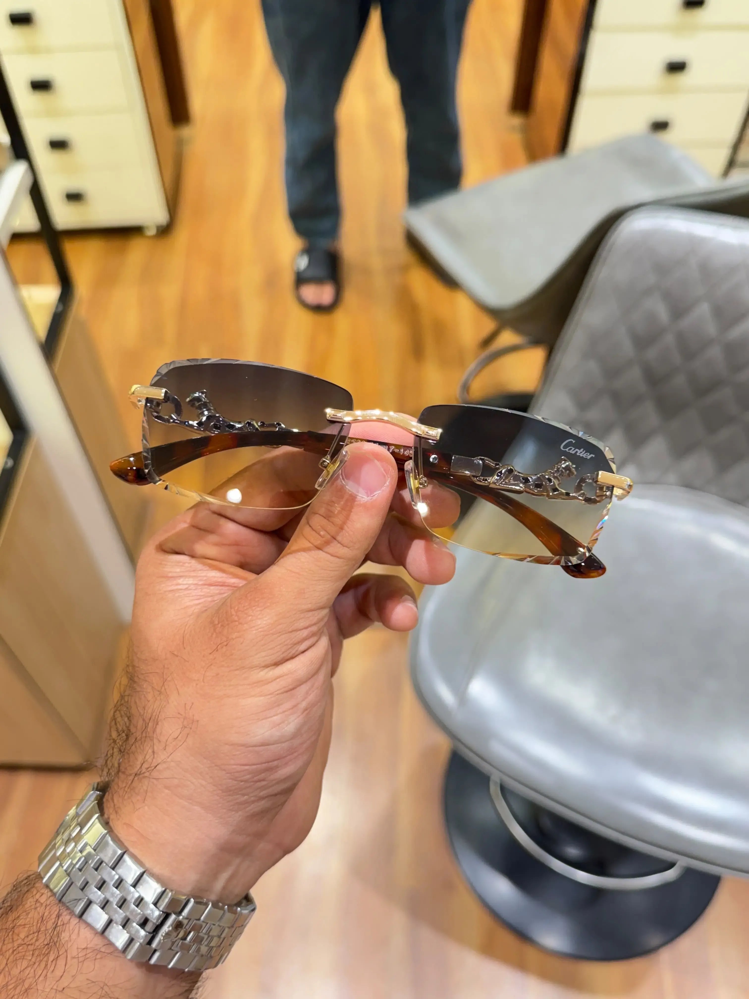 Rimless gold panther sea green sunglasses - angled view showing sea green gradient lenses and gold panther bridge