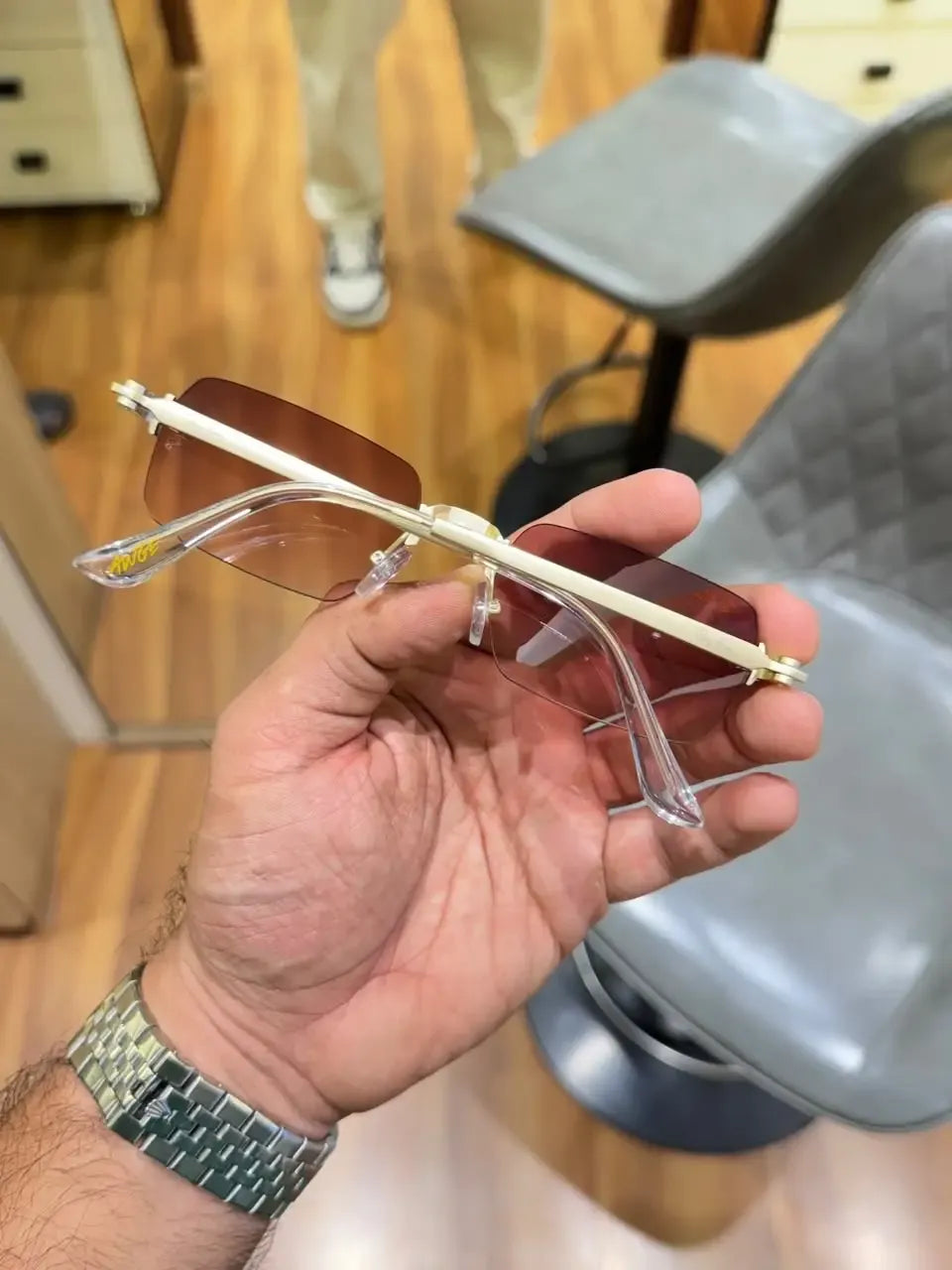 Ray-Ban Rocky Gold Brown - Folded side view showing gold hardware and transparent tips