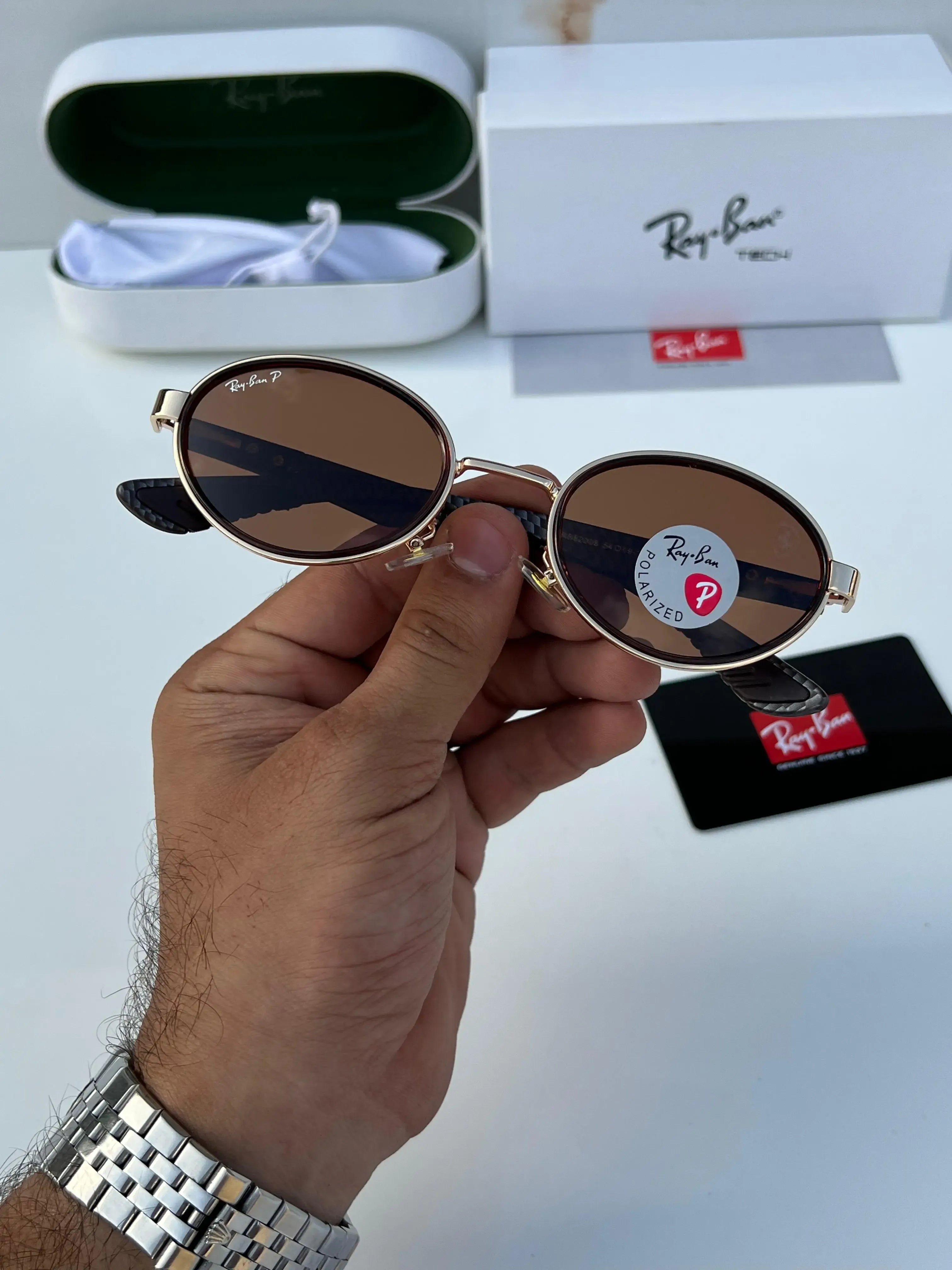Ray-Ban x Ferrari RB8206 Gold Brown - Side temple view showing carbon fibre weave arms with Ferrari Prancing Horse badge