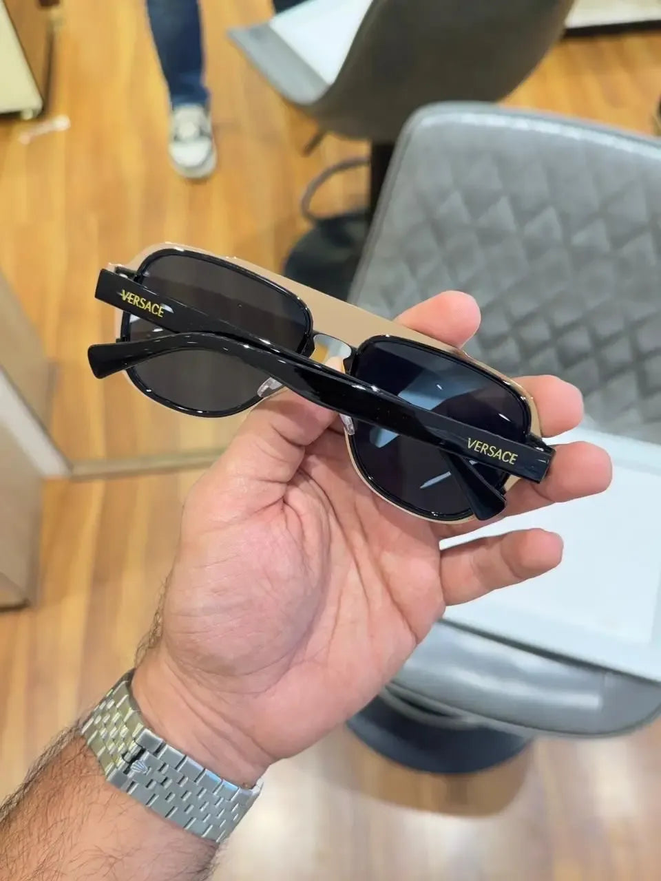 Versace Medusa Double Bridge Aviator Sunglasses Black Gold - Folded Hand View