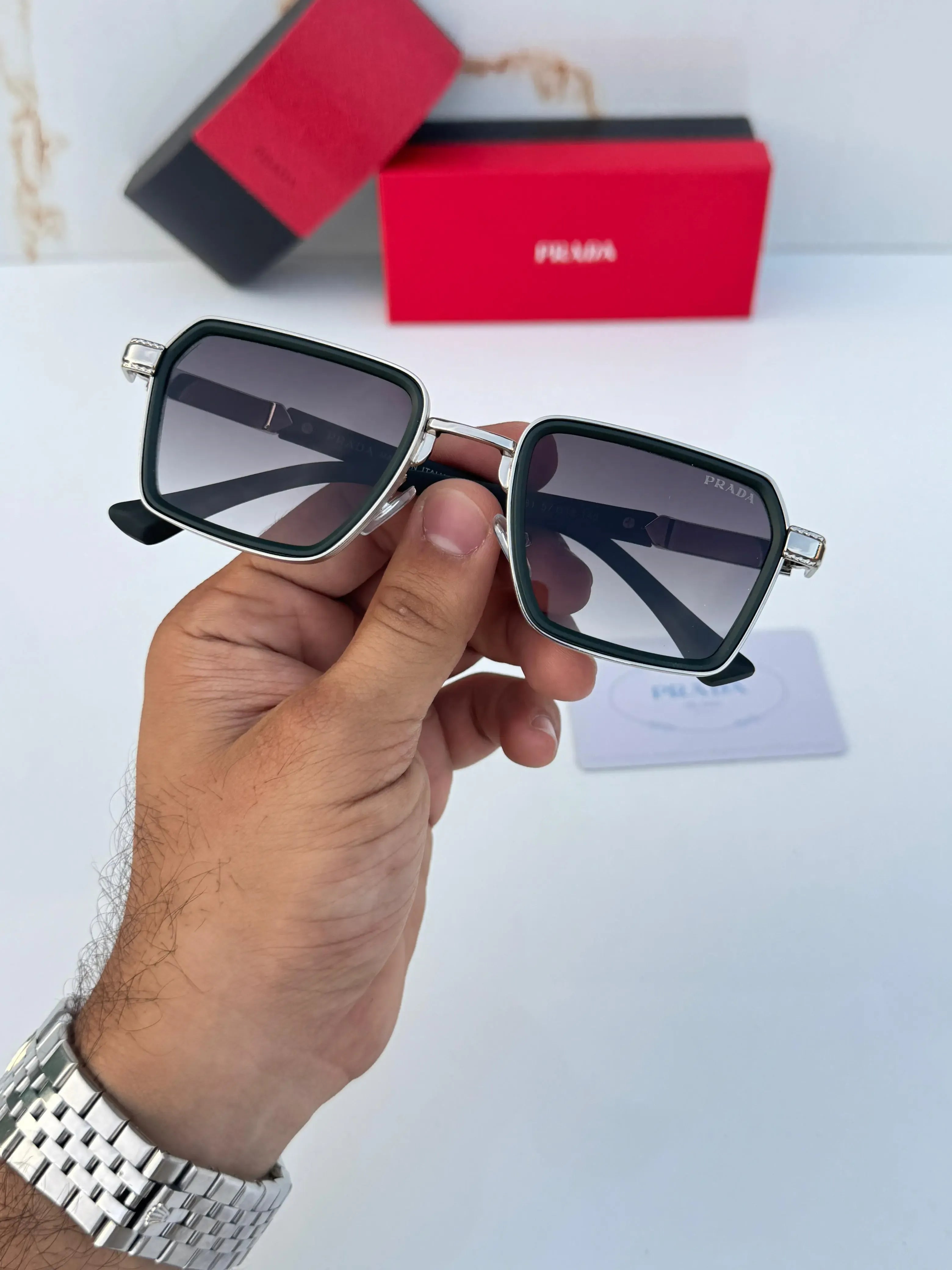 Prada Urban Square Sunglasses Black Silver - Hand Hold Front View