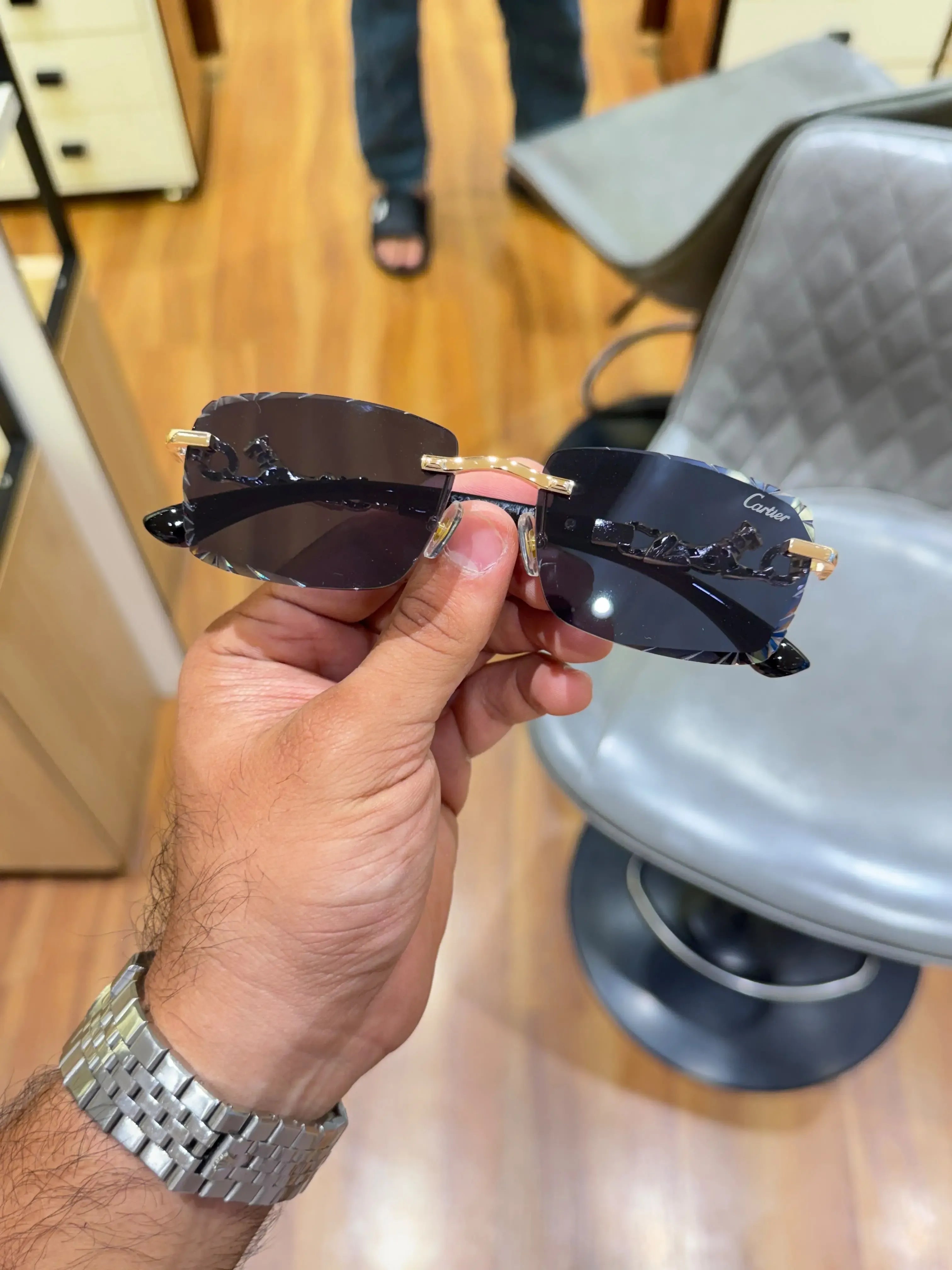 Rimless panther gold sunglasses - folded side view