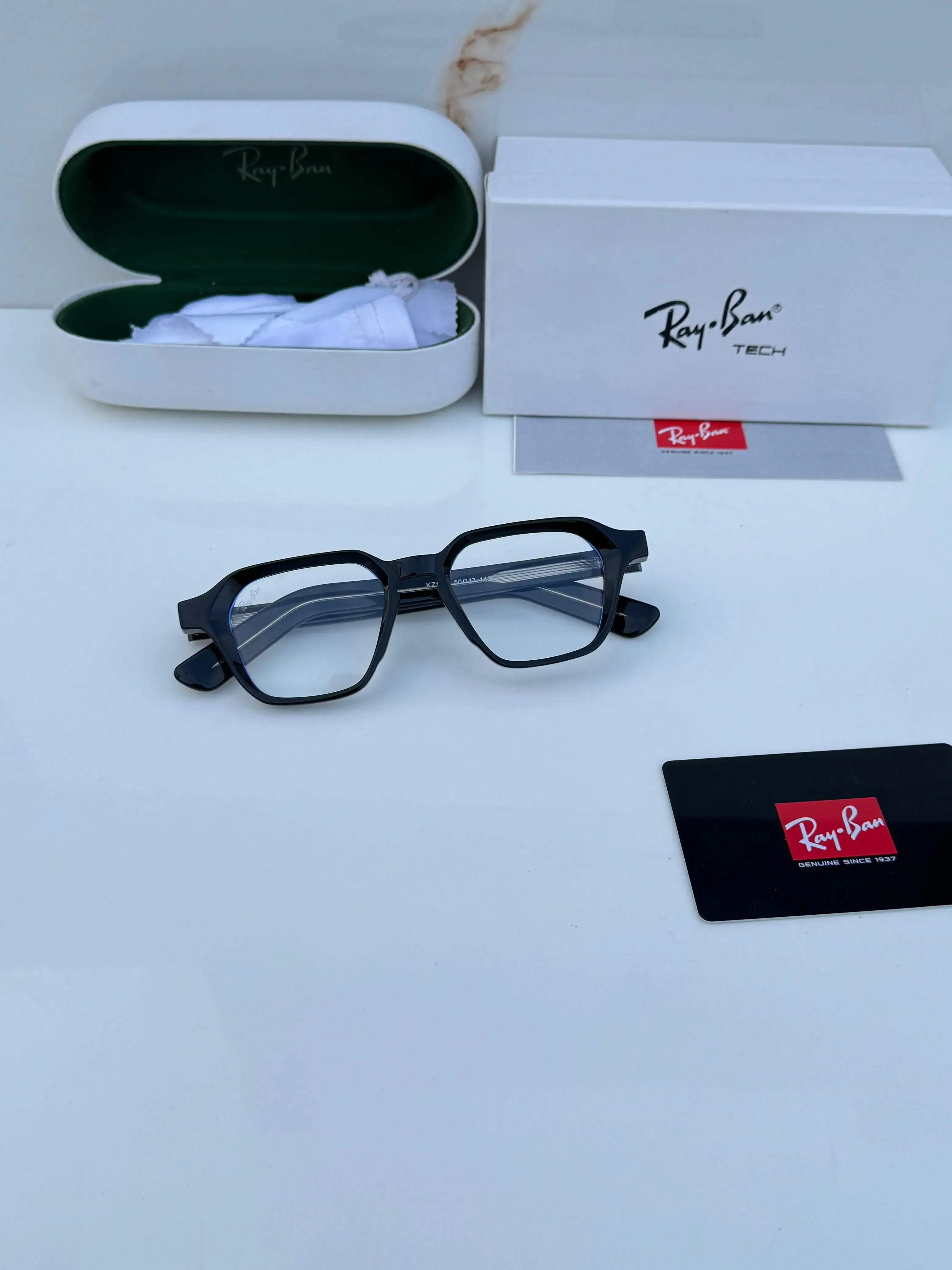Ray-Ban RB1115 Black Plano - Hand holding frame showing 50-17-145 size marking and Ray-Ban logo