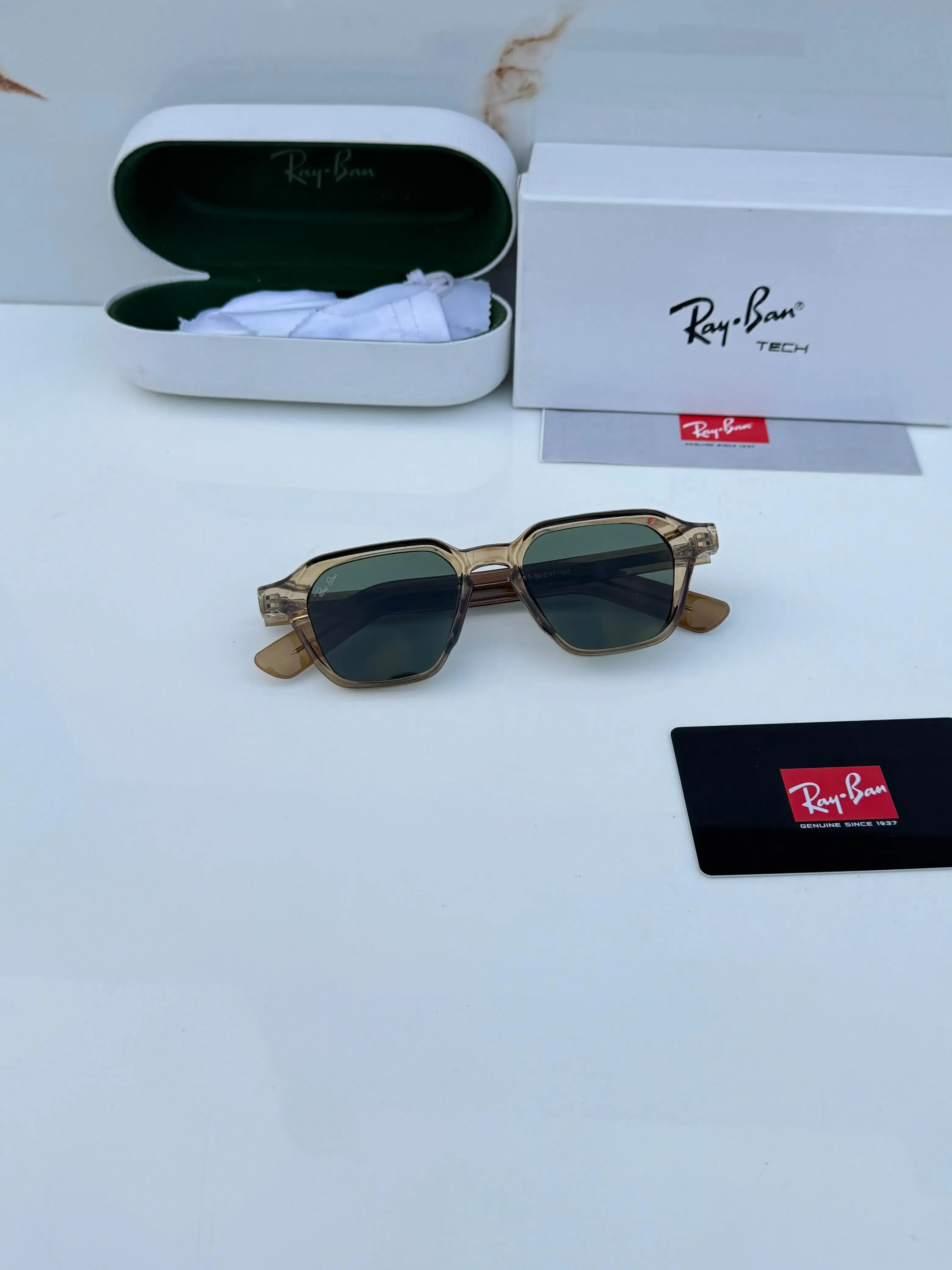 Ray-Ban RB1115 Brown Green - Hand holding frame showing transparent brown acetate and green lenses