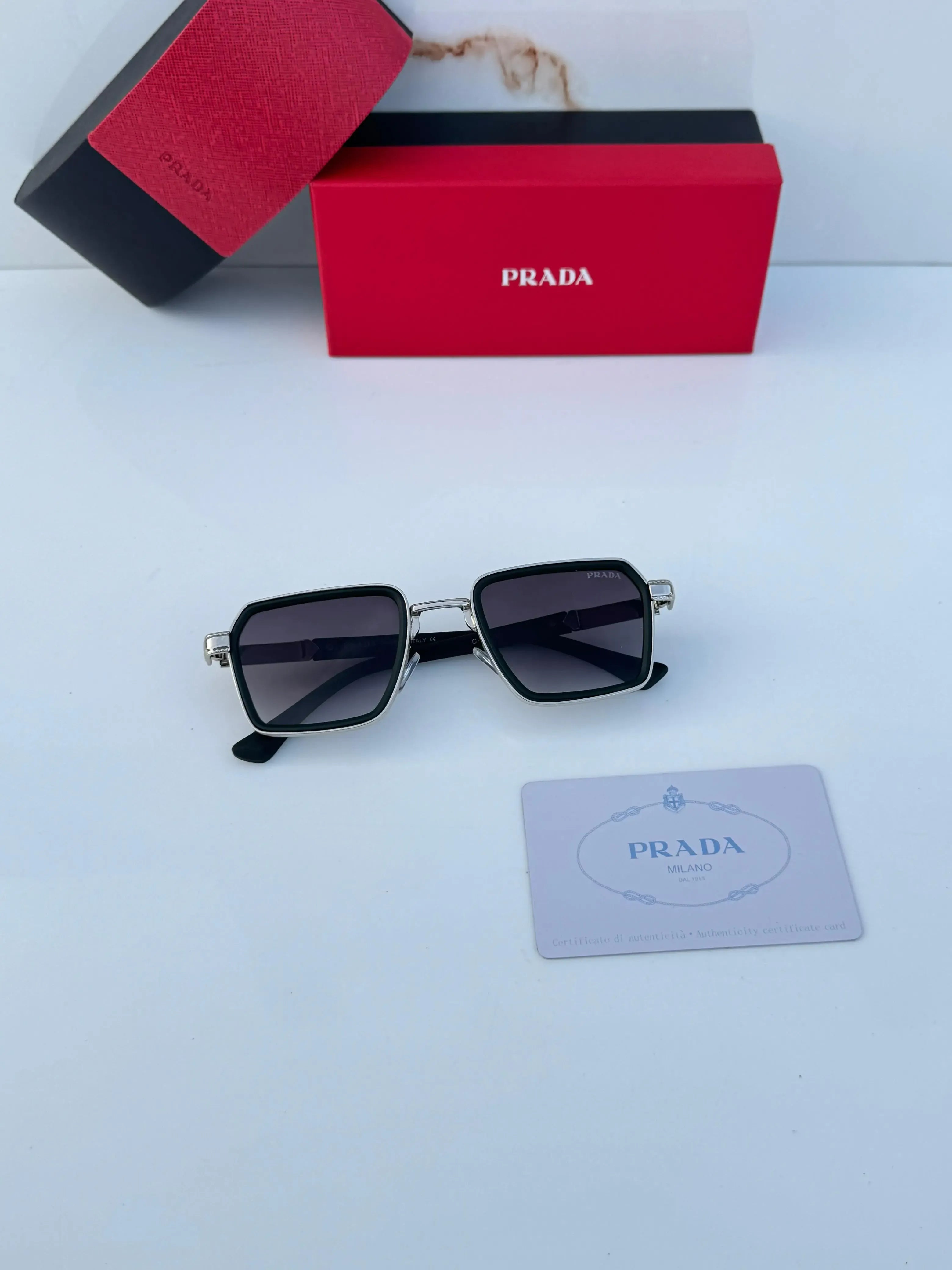Prada Urban Square Sunglasses Black Silver - Flat Lay with Box