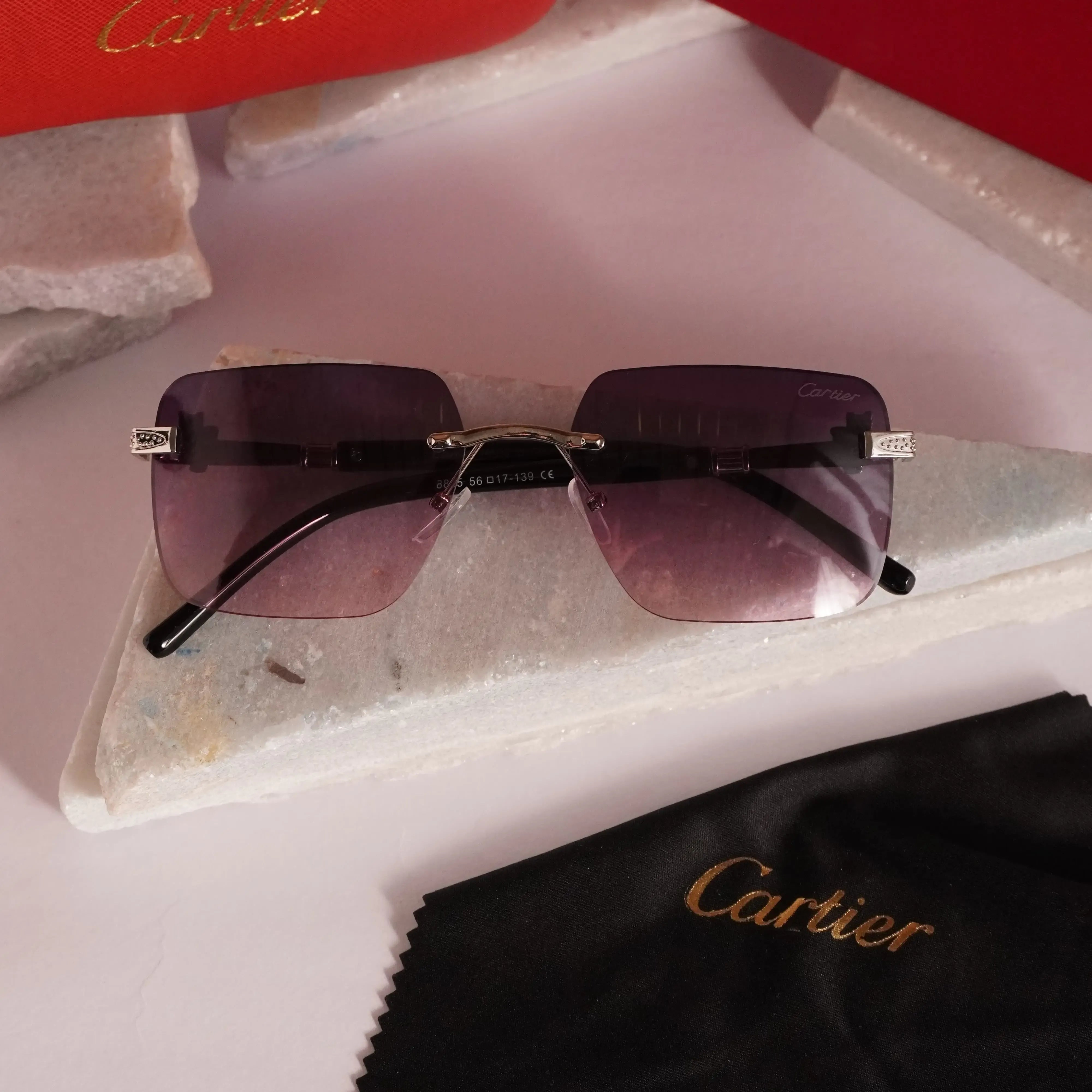 Violet gradient rimless square sunglasses - flat lay with case and cloth