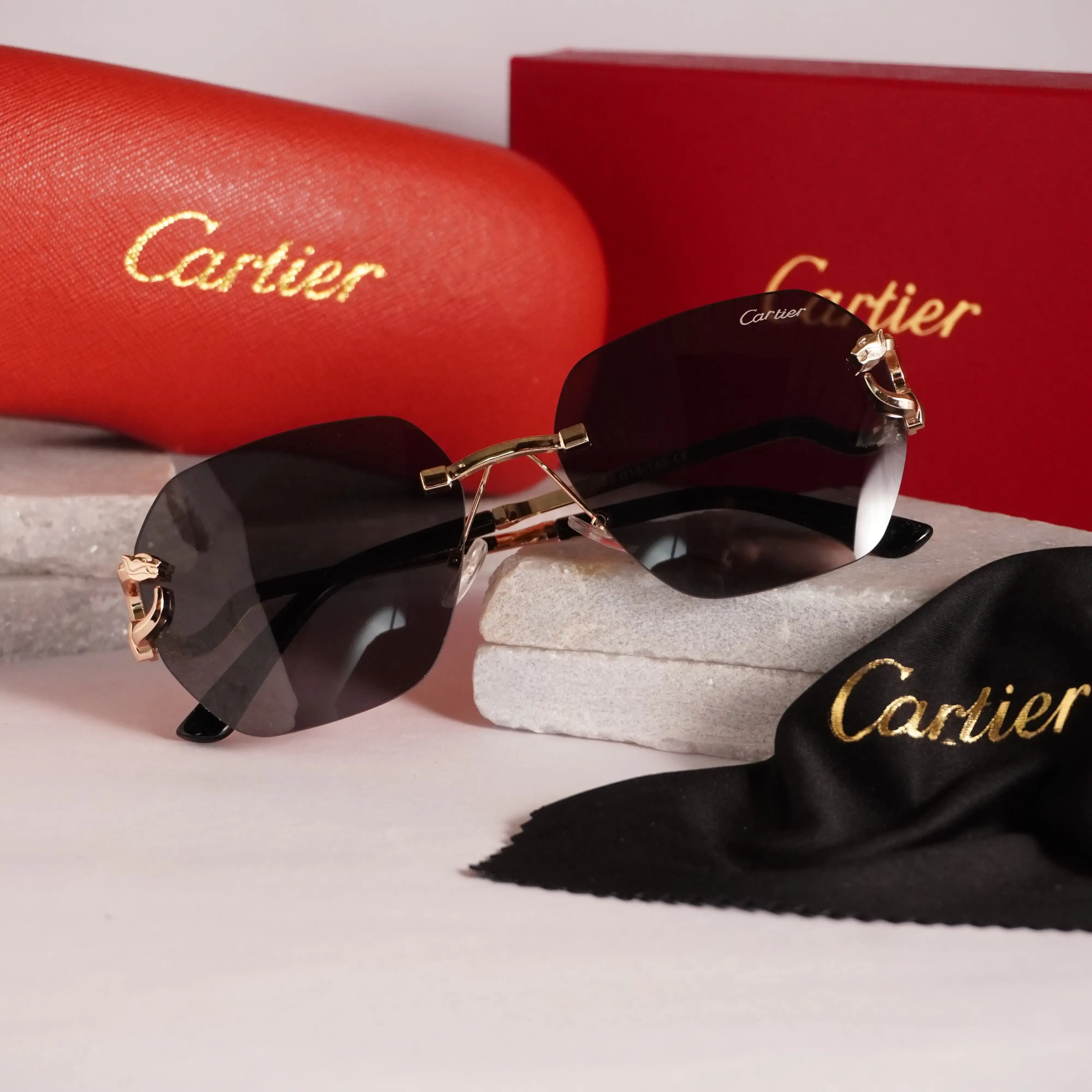 Rimless gold panther black sunglasses - close up bridge and lens detail showing bevelled edges
