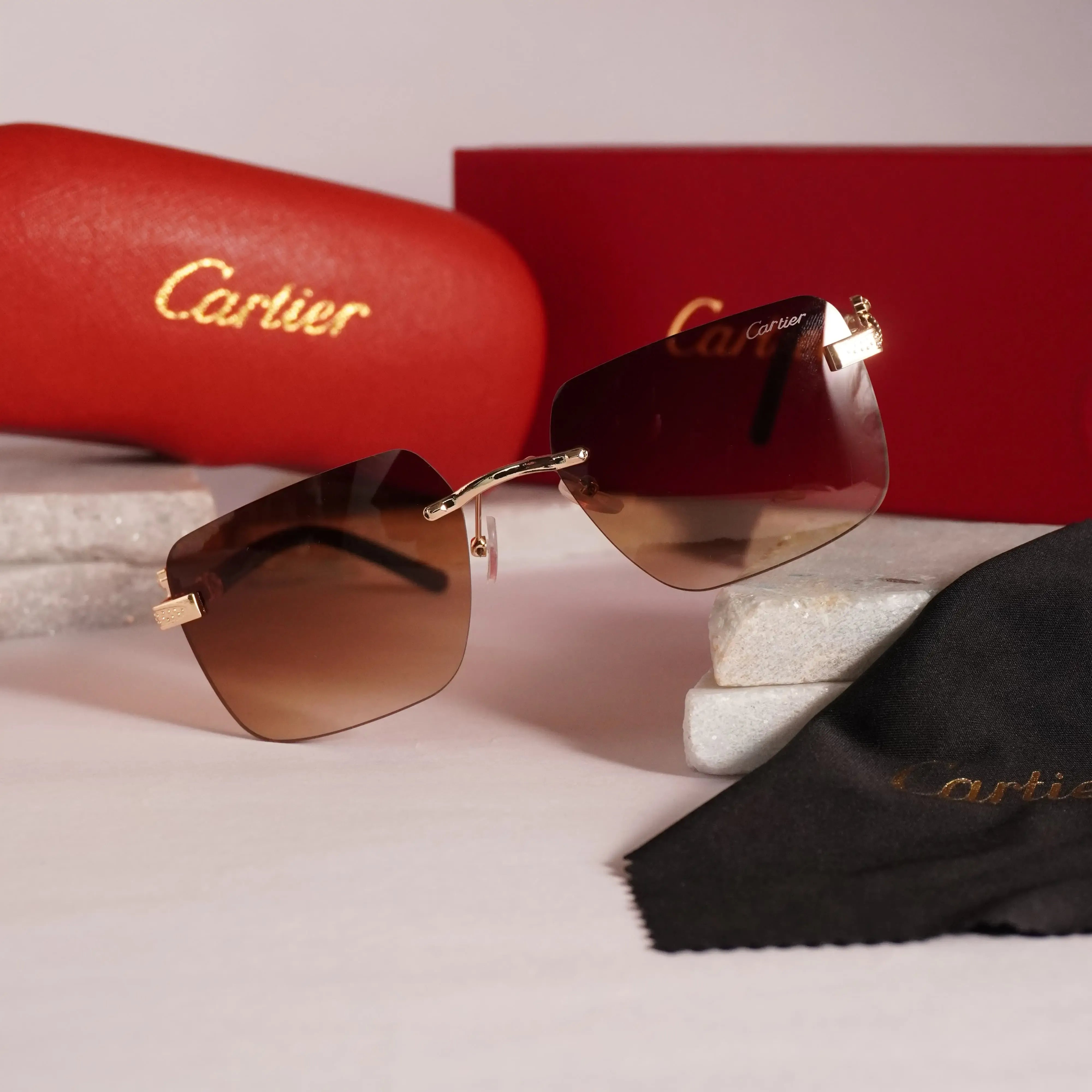 Rimless square gold brown gradient sunglasses - front view with Cartier red box and cleaning cloth