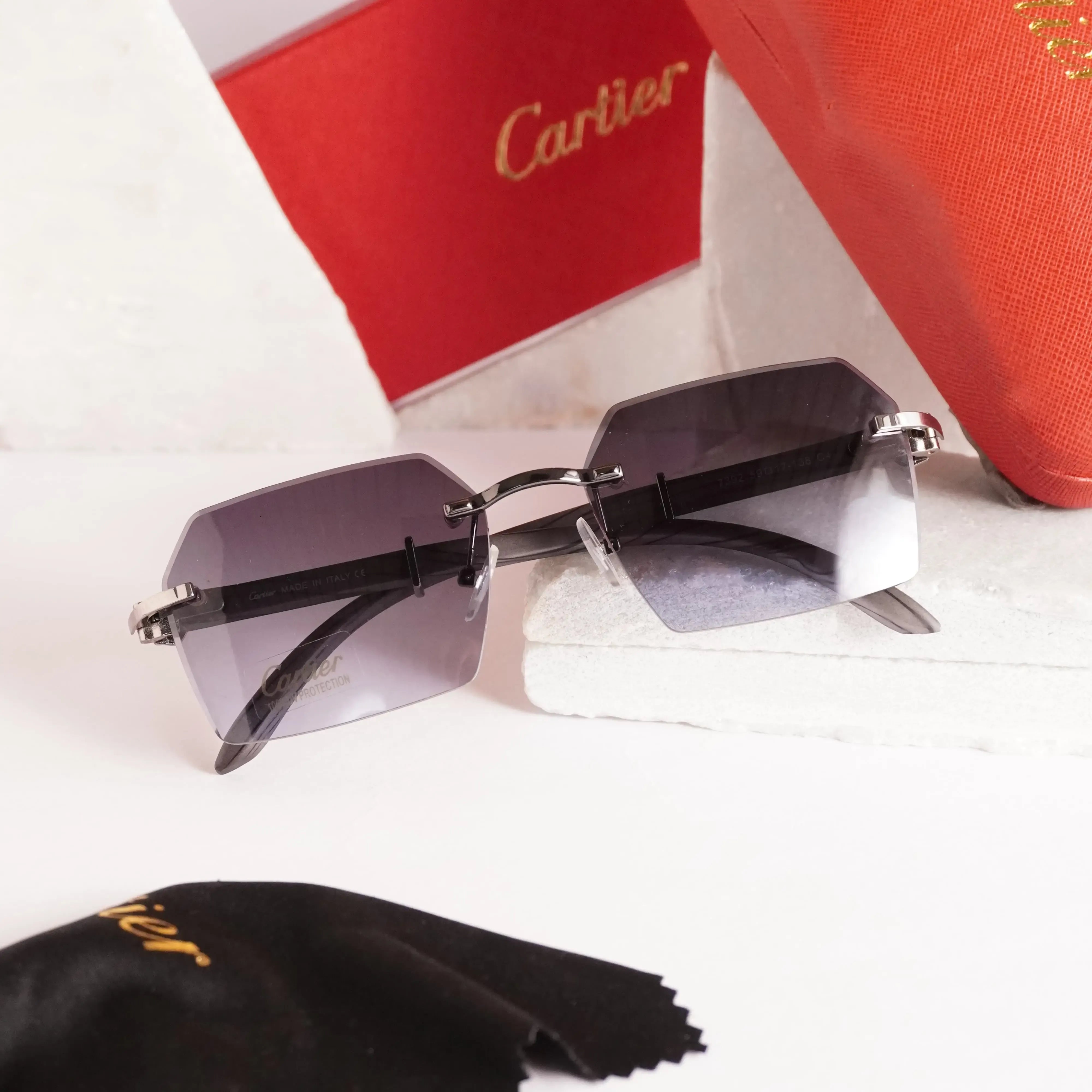 Rimless diamond-cut sunglasses - side angle showing slim dark grey temples and gradient lenses